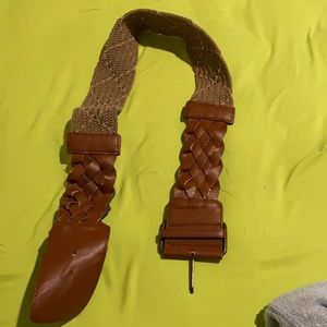 Brown braided belt. Some stretch on braided area. Ends with faux leather.
